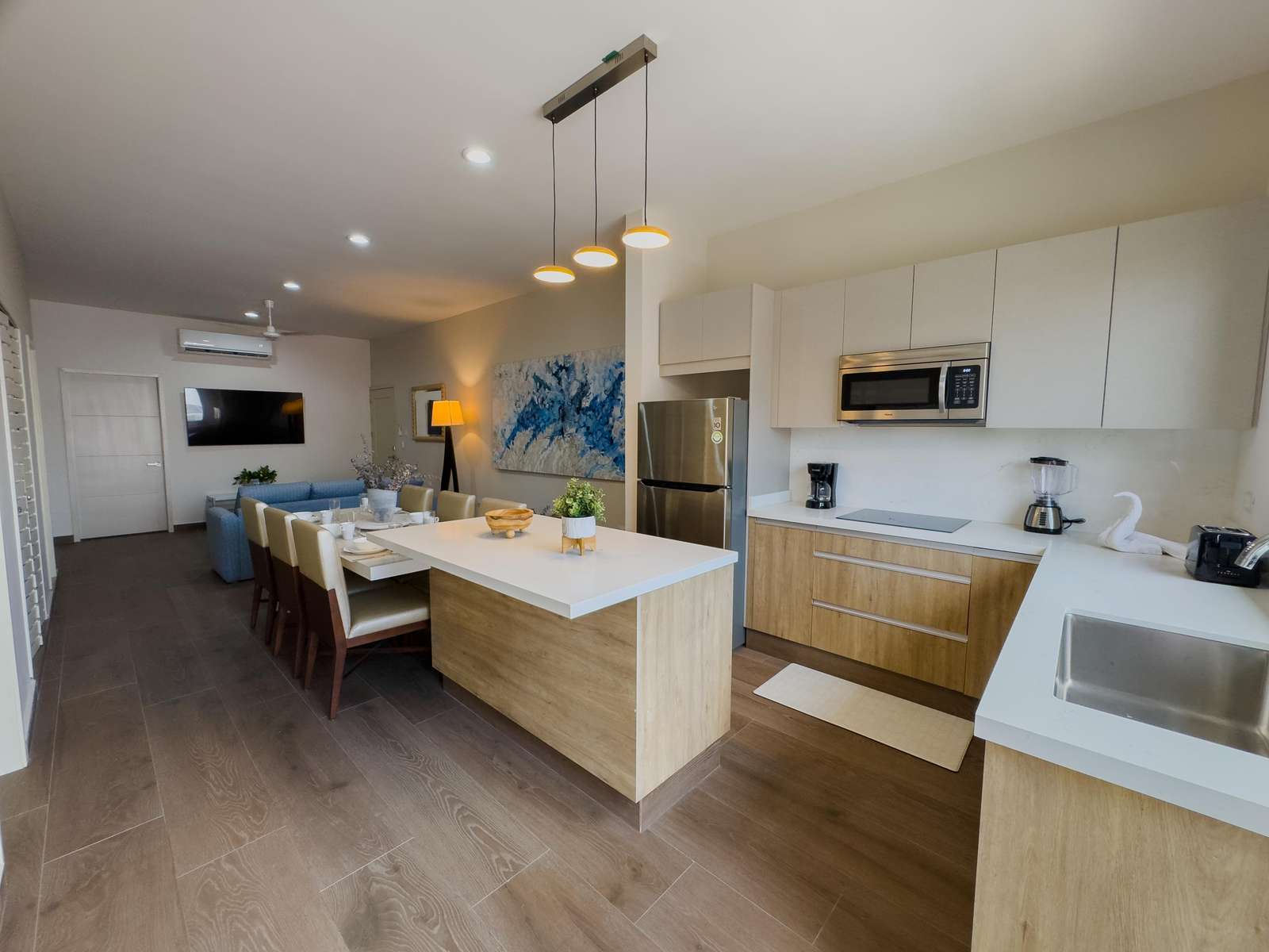 Kitchen, dining and living areas - property