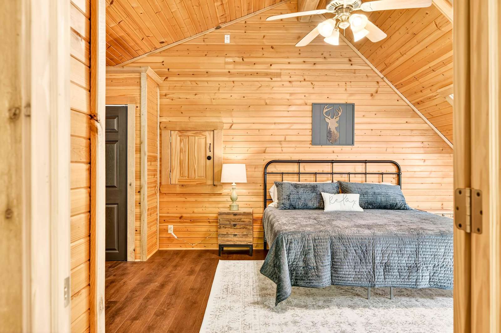 Cozy bedroom retreat with warm wood accents and natural light