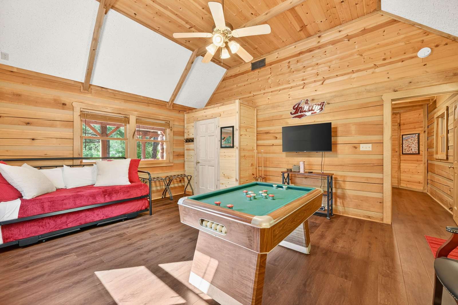 Cozy game room with rustic charm and natural light