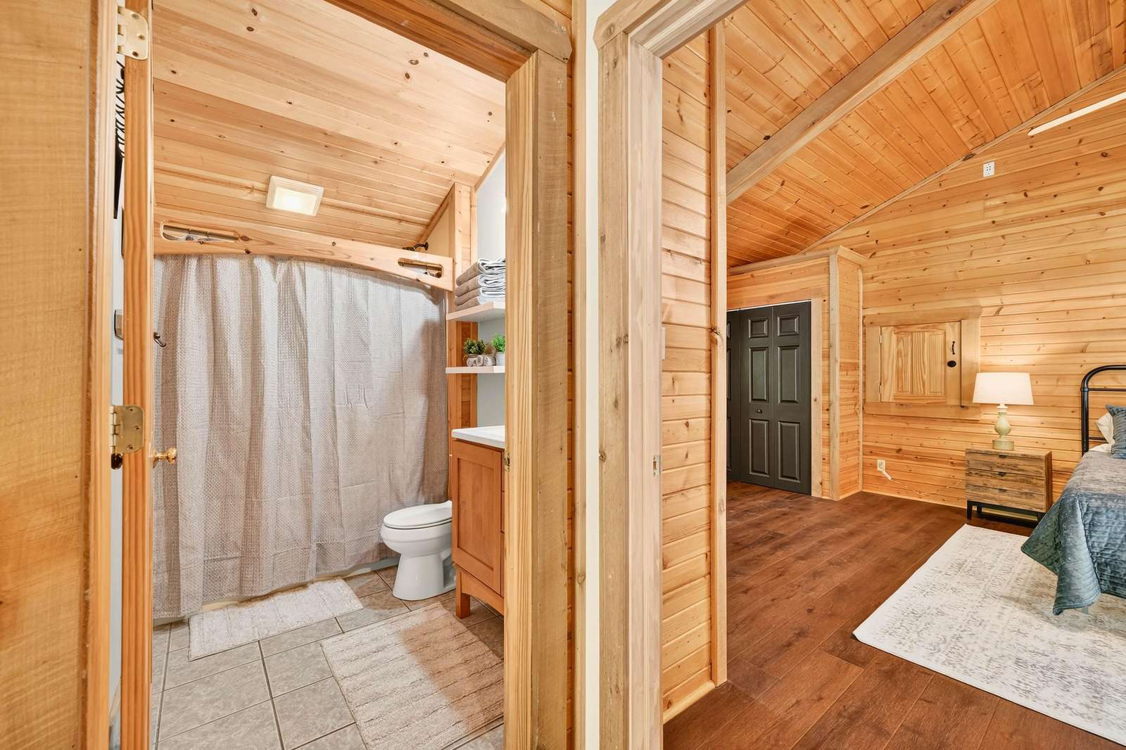 Cozy rustic bathroom and living area with warm wood accents