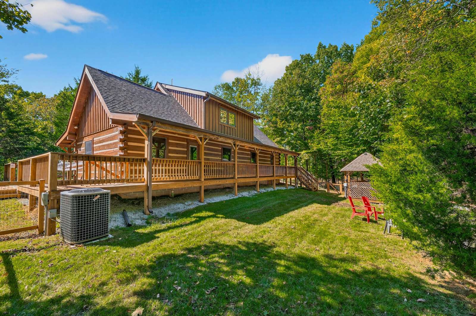Spacious backyard retreat with charming log cabin comfort