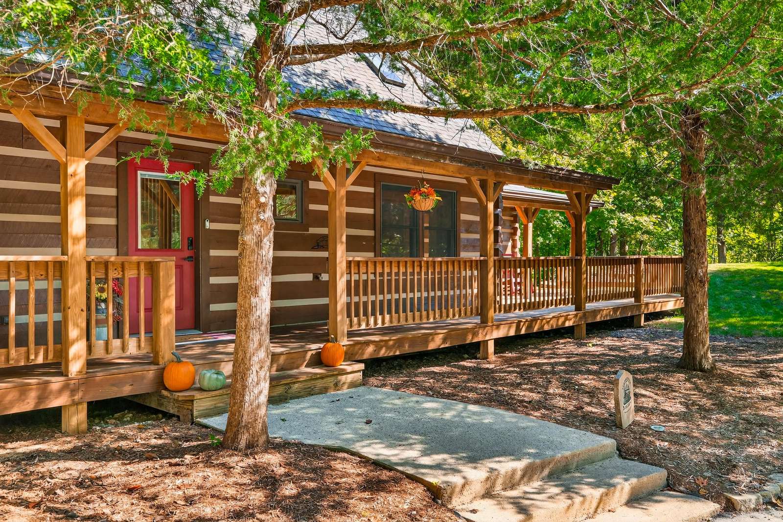 Cozy cabin porch surrounded by tranquil forest shade