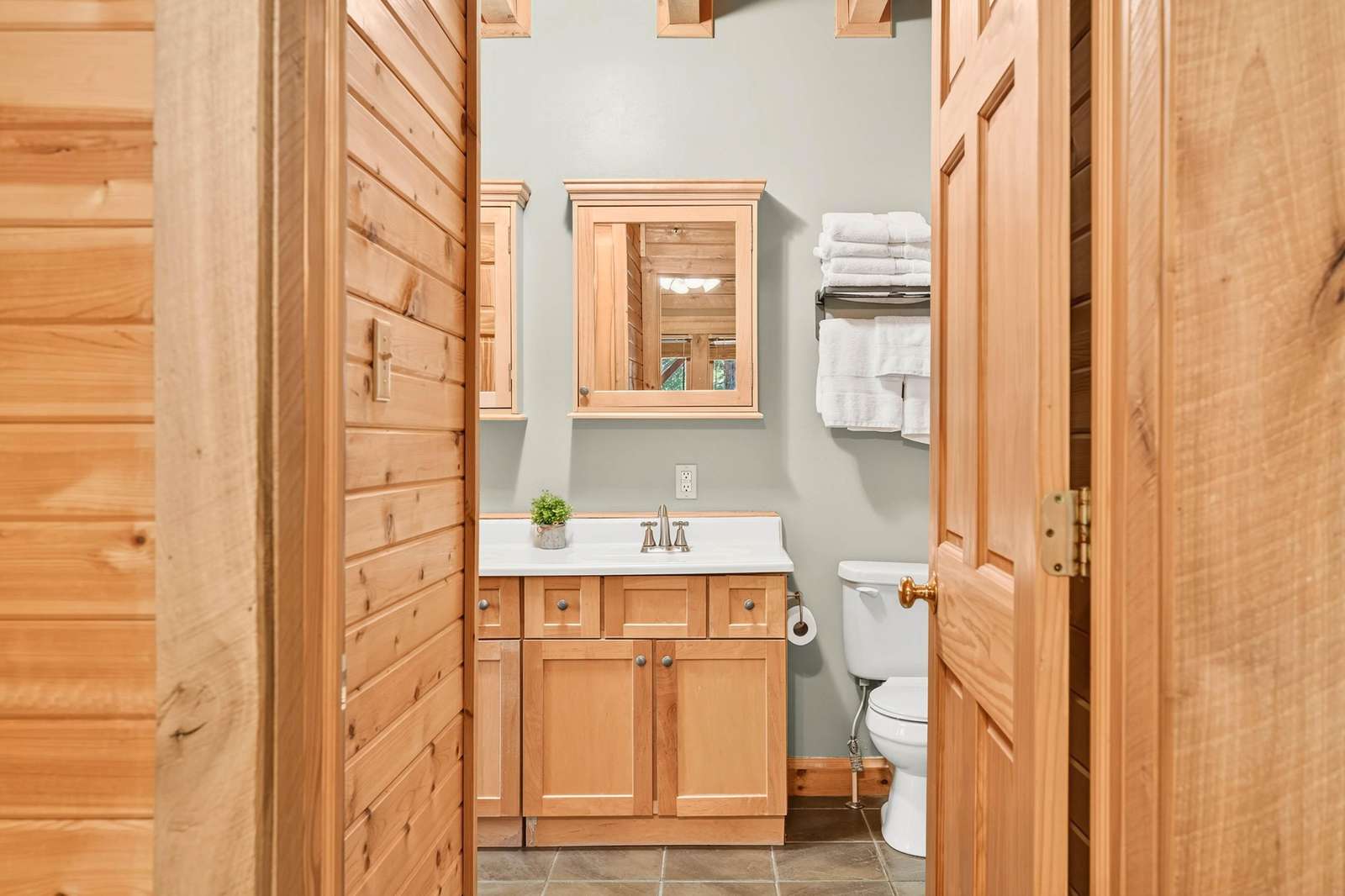 Cozy bathroom retreat with warm wood accents and bright lighting