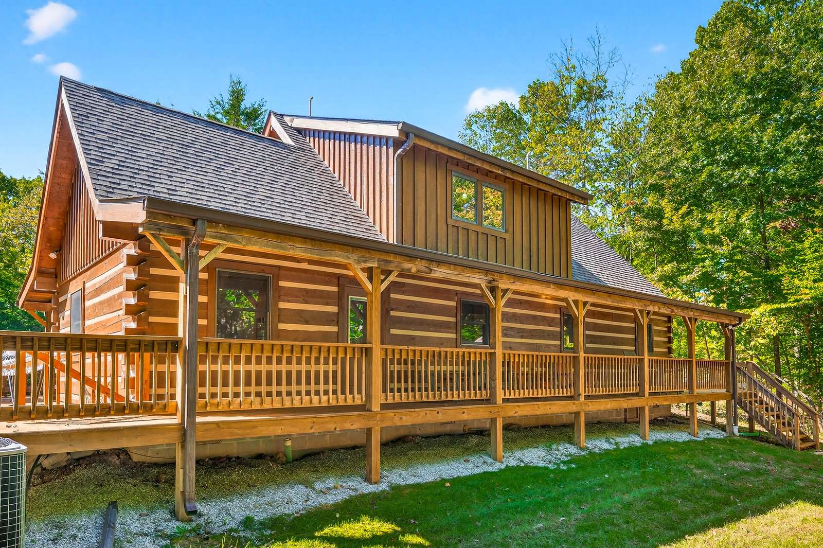 Spacious log cabin with expansive wraparound deck for relaxing outdoors