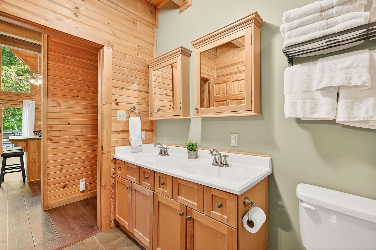 Cozy bathroom retreat with warm wood accents and natural light