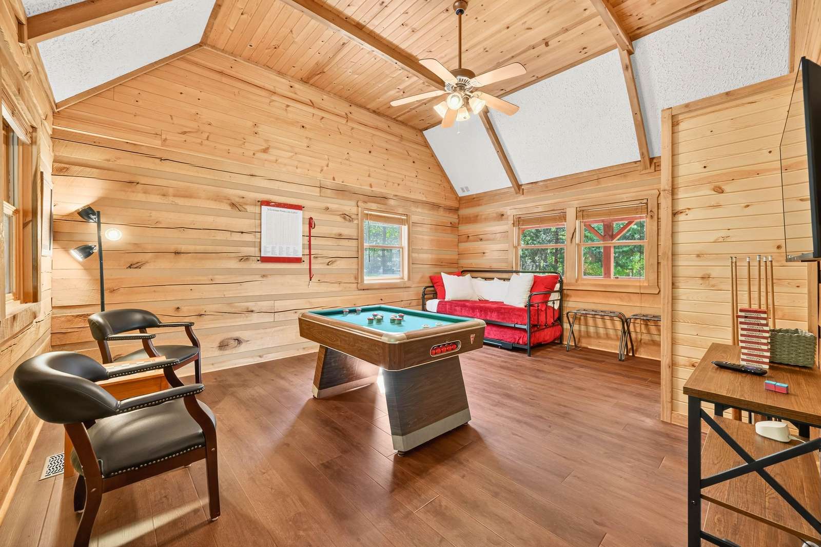 Spacious game room with vaulted ceilings and cozy seating