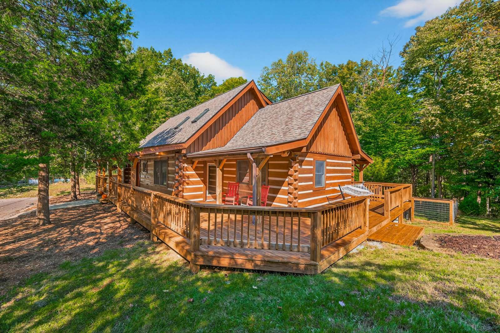 Cozy log cabin retreat with spacious wraparound deck