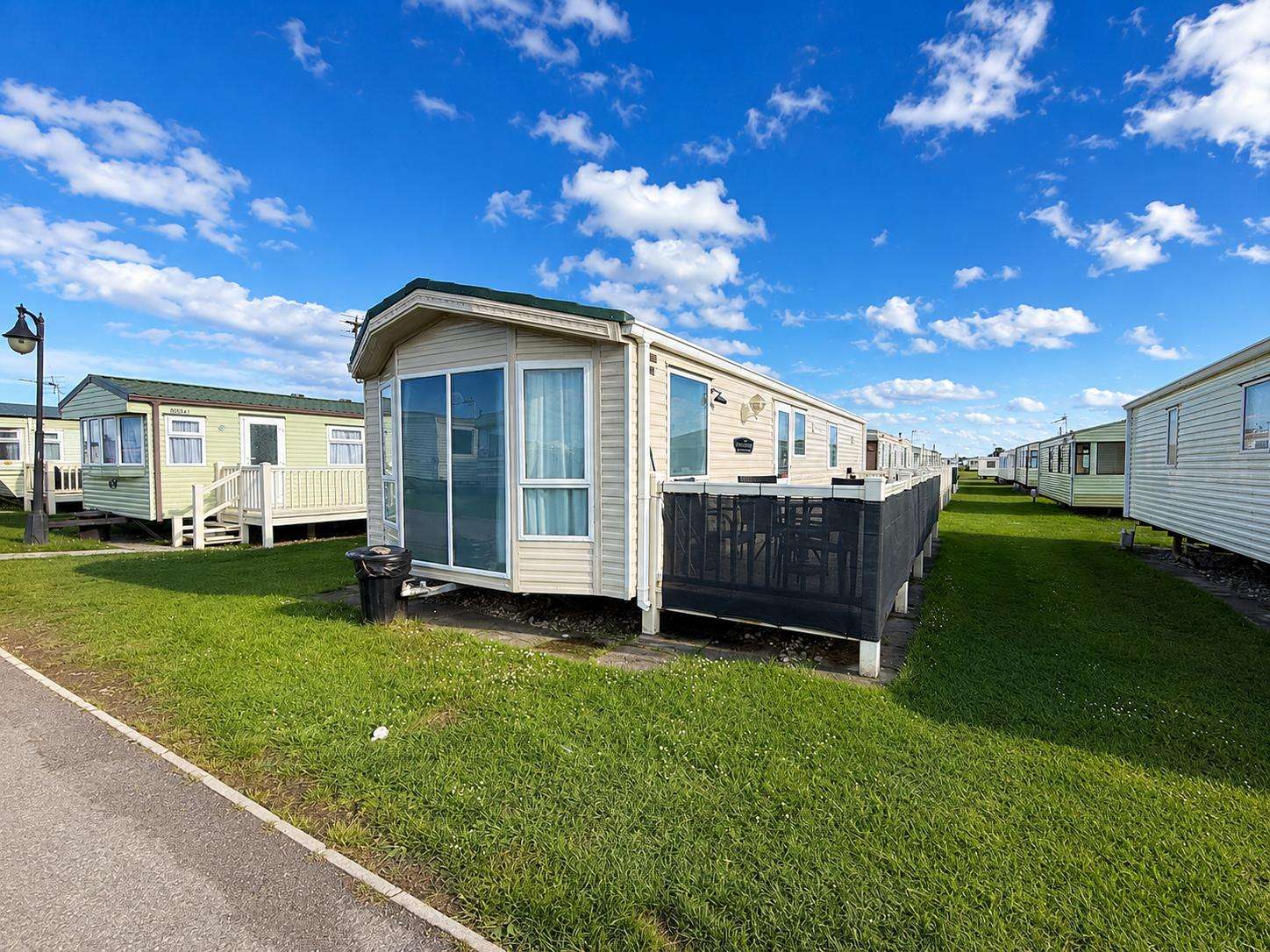 Lovely 2-bedroom caravan sleeping up to 4 guests, perfect for couples and small families. - property