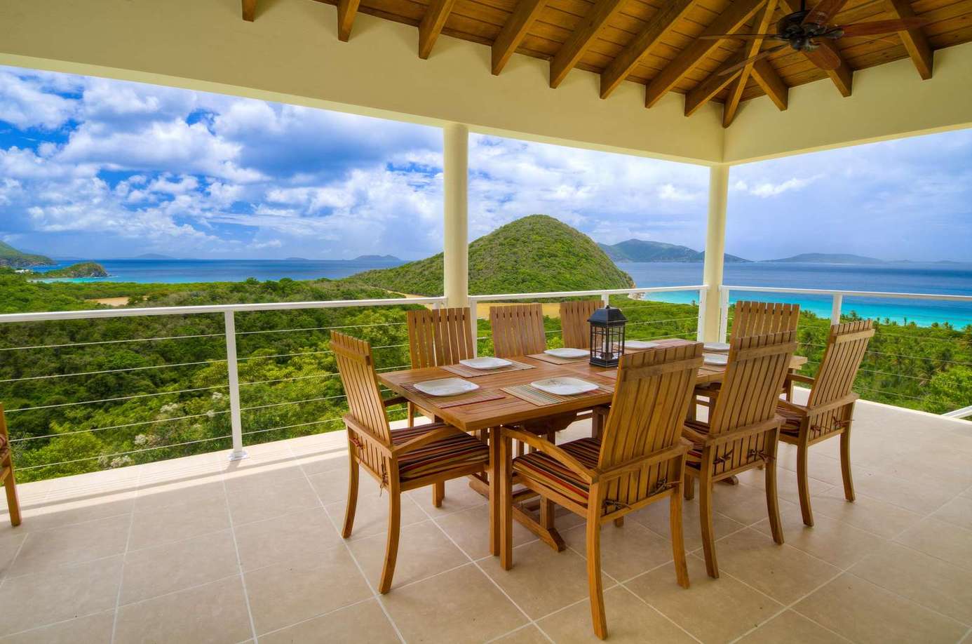 Spacious outdoor dining with panoramic mountain and ocean views