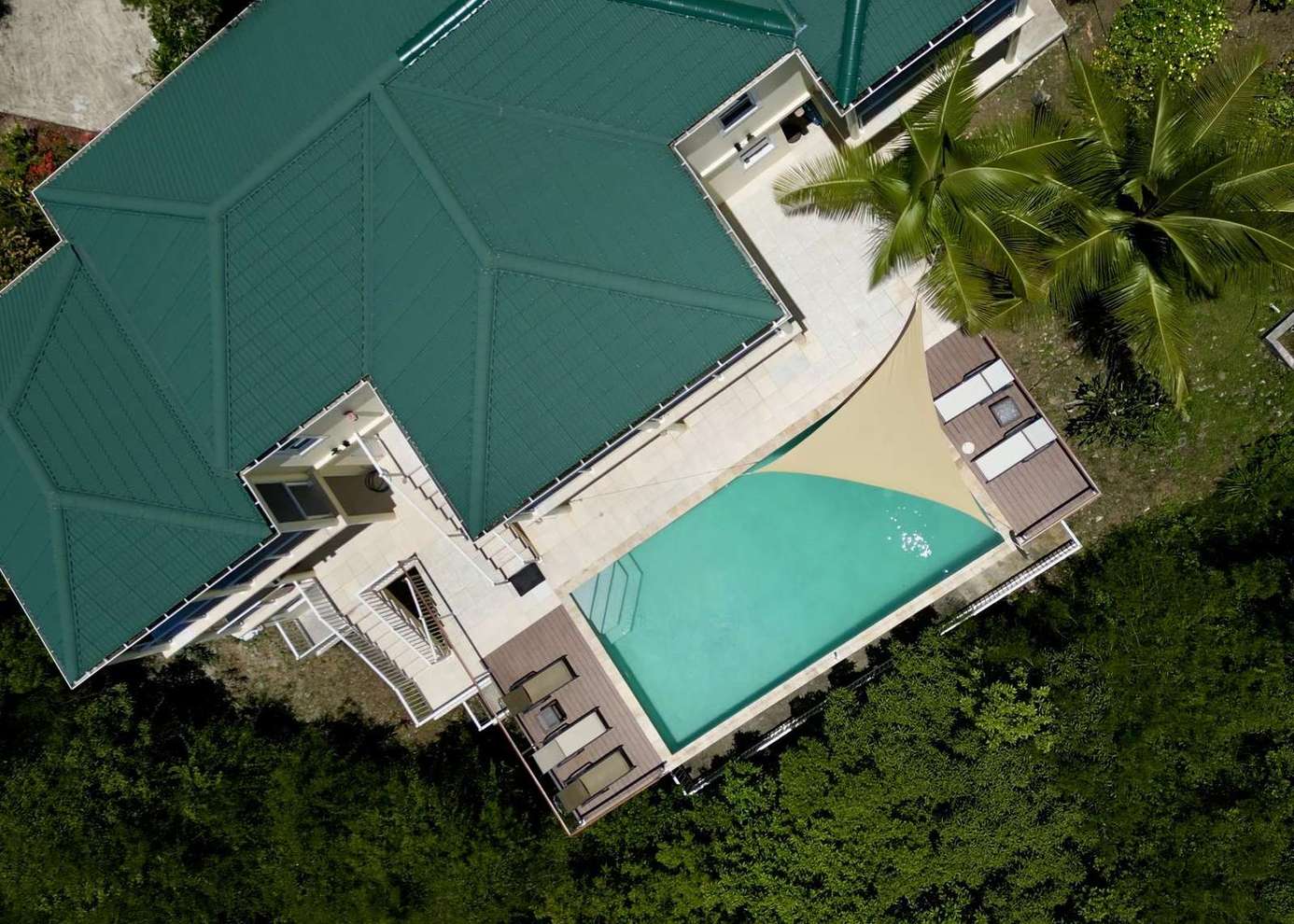 Secluded poolside retreat with lush tropical surroundings
