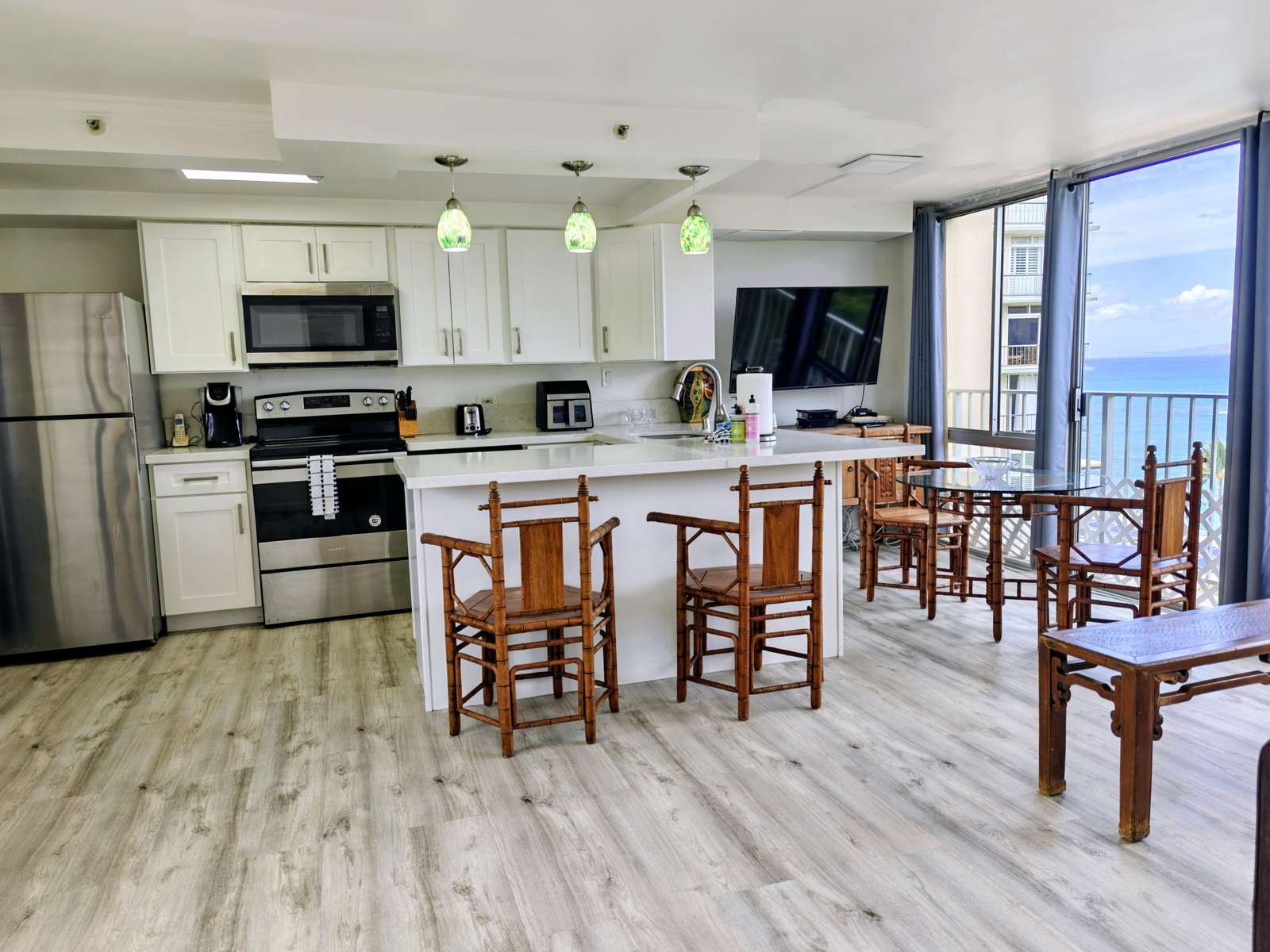 Bright, open kitchen with ocean views and casual dining