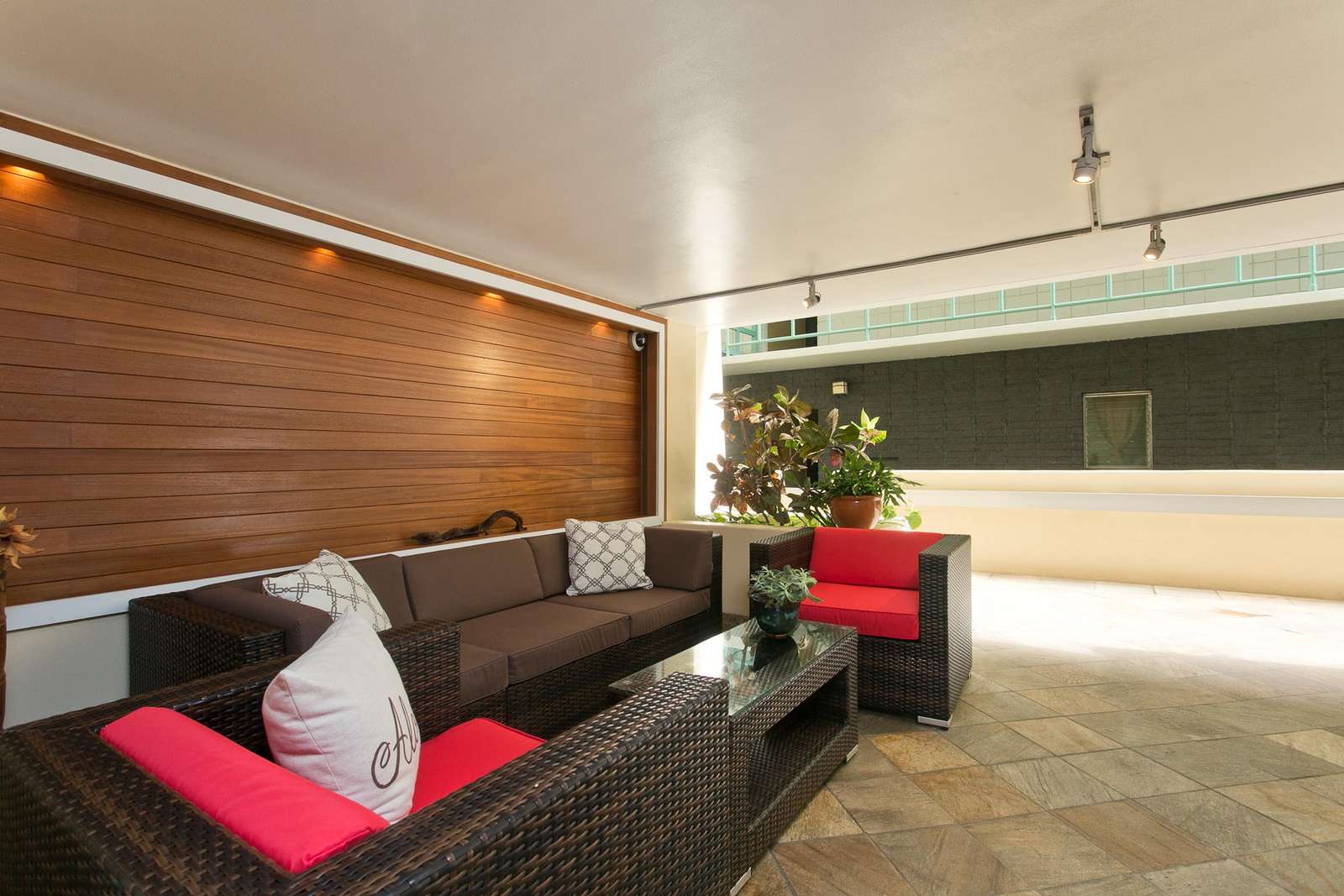 Cozy covered patio with stylish seating for relaxing gatherings