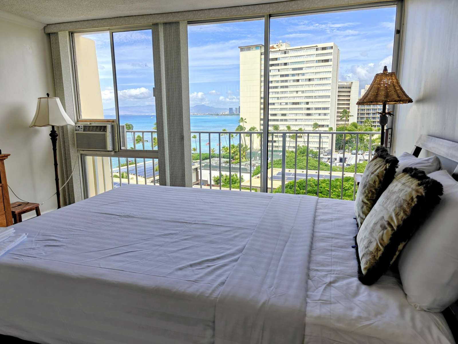 Bright bedroom with stunning city and ocean views