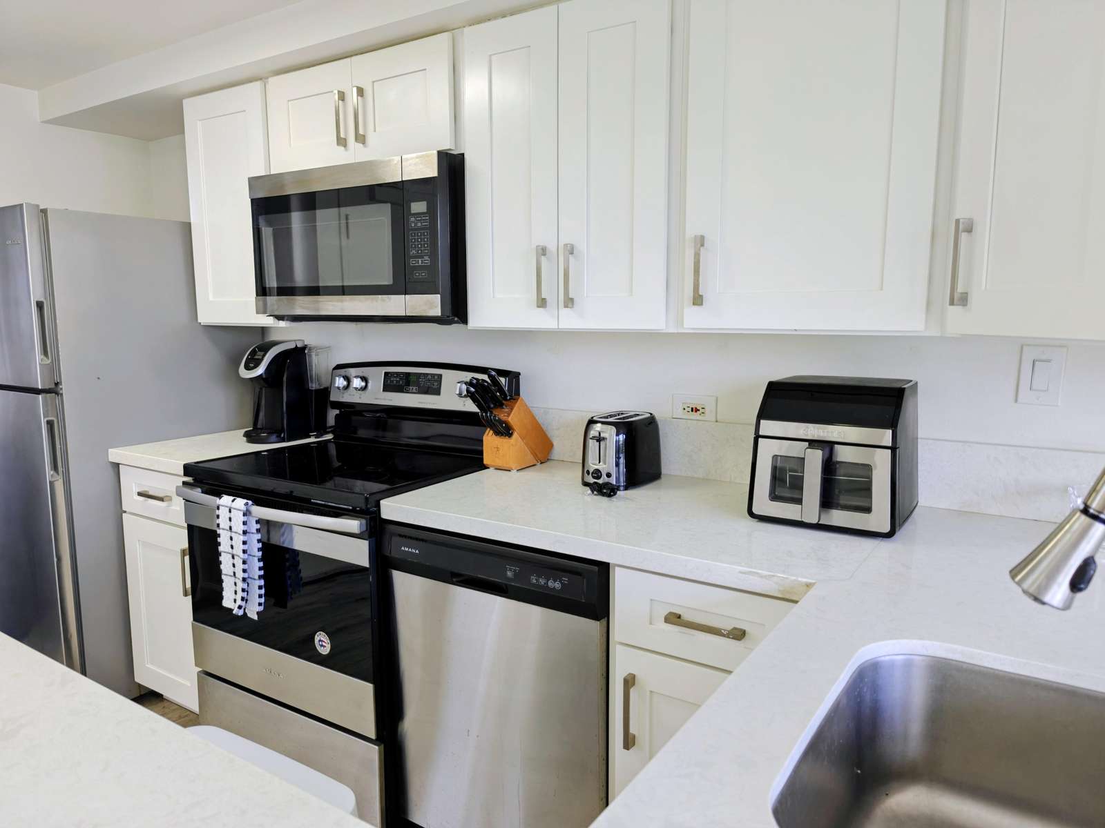 Modern kitchen with sleek appliances and bright cabinetry
