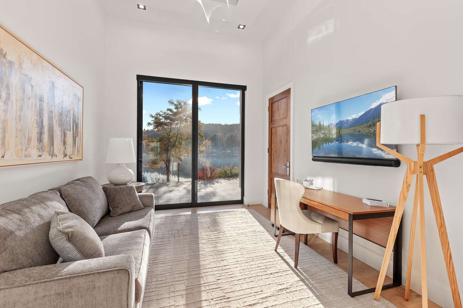 Bright living room with cozy seating and scenic views