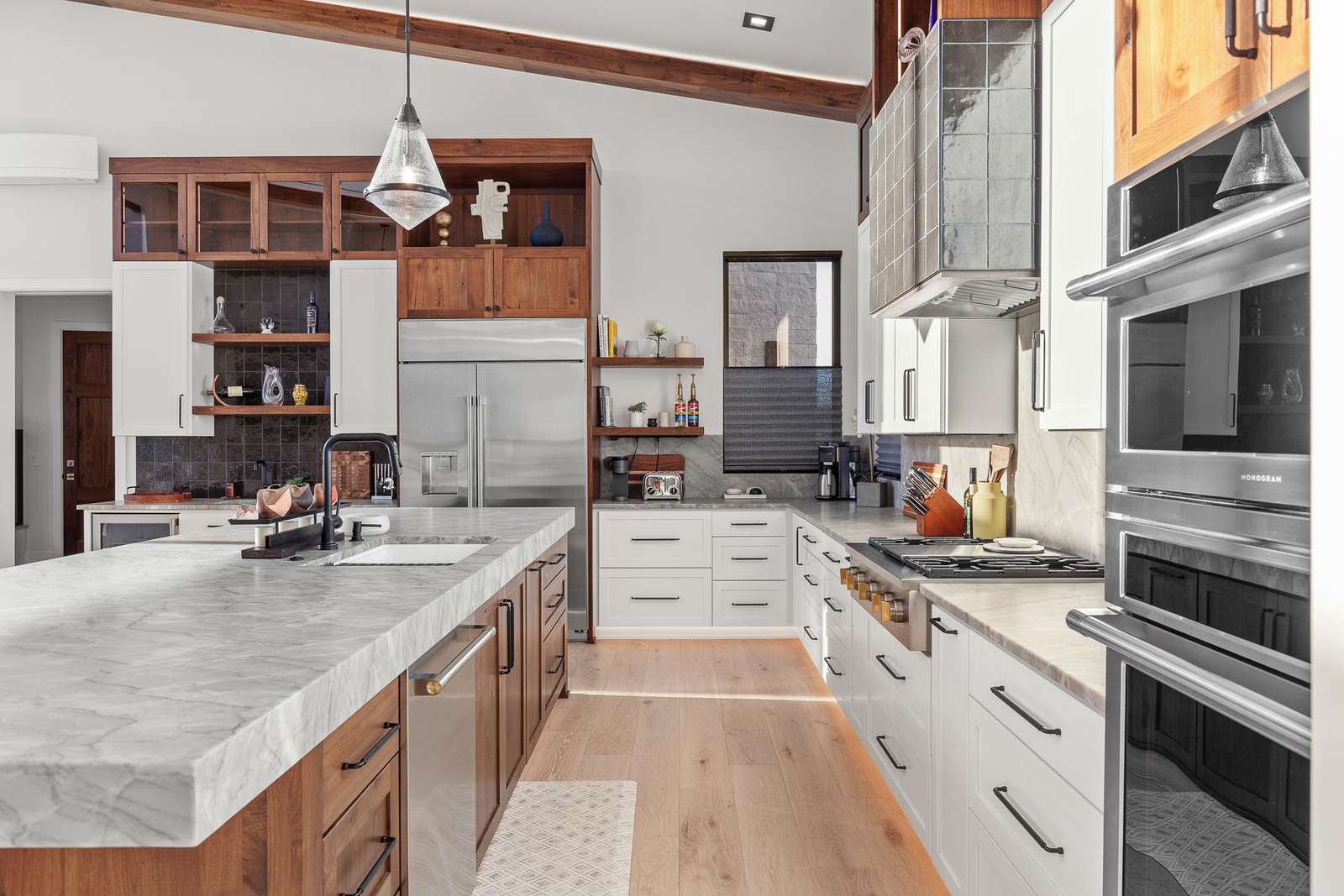Spacious kitchen with marble island and modern appliances