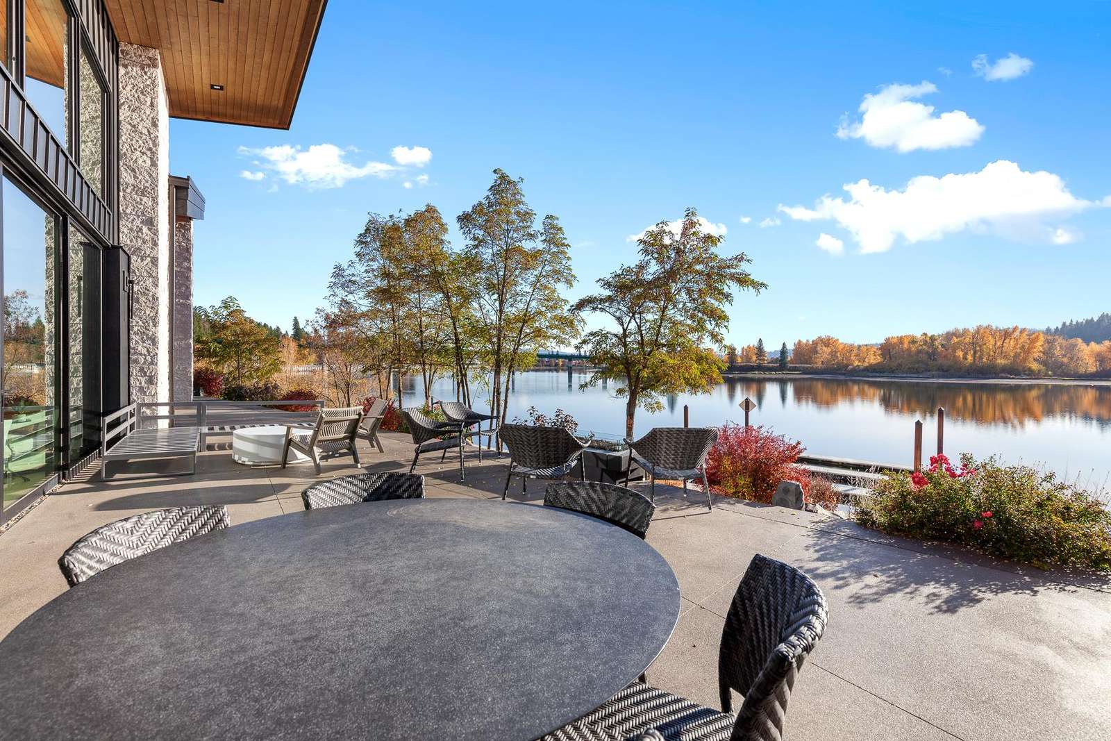 Lakeside patio with cozy seating and stunning water views