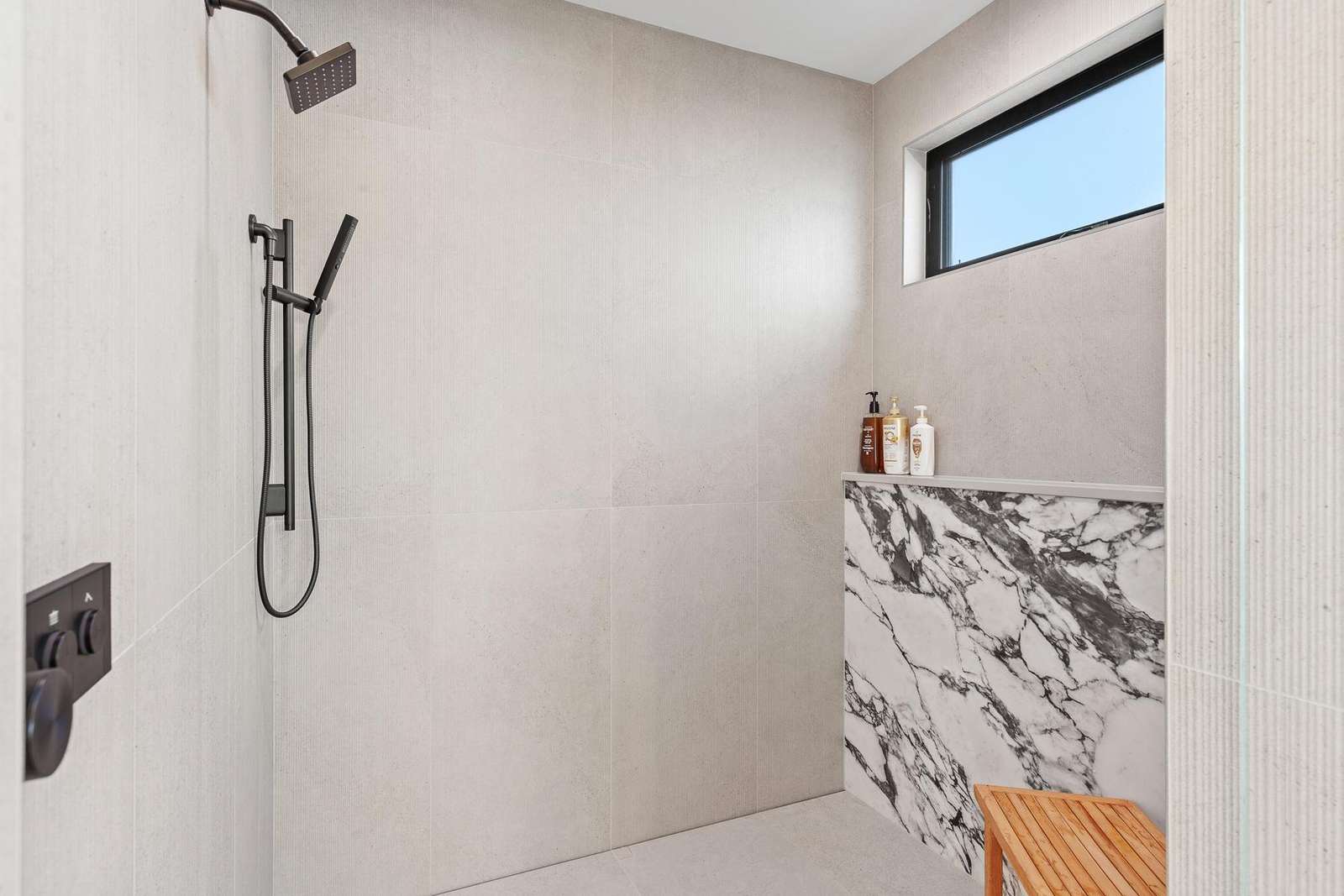 Modern shower with sleek fixtures and natural light