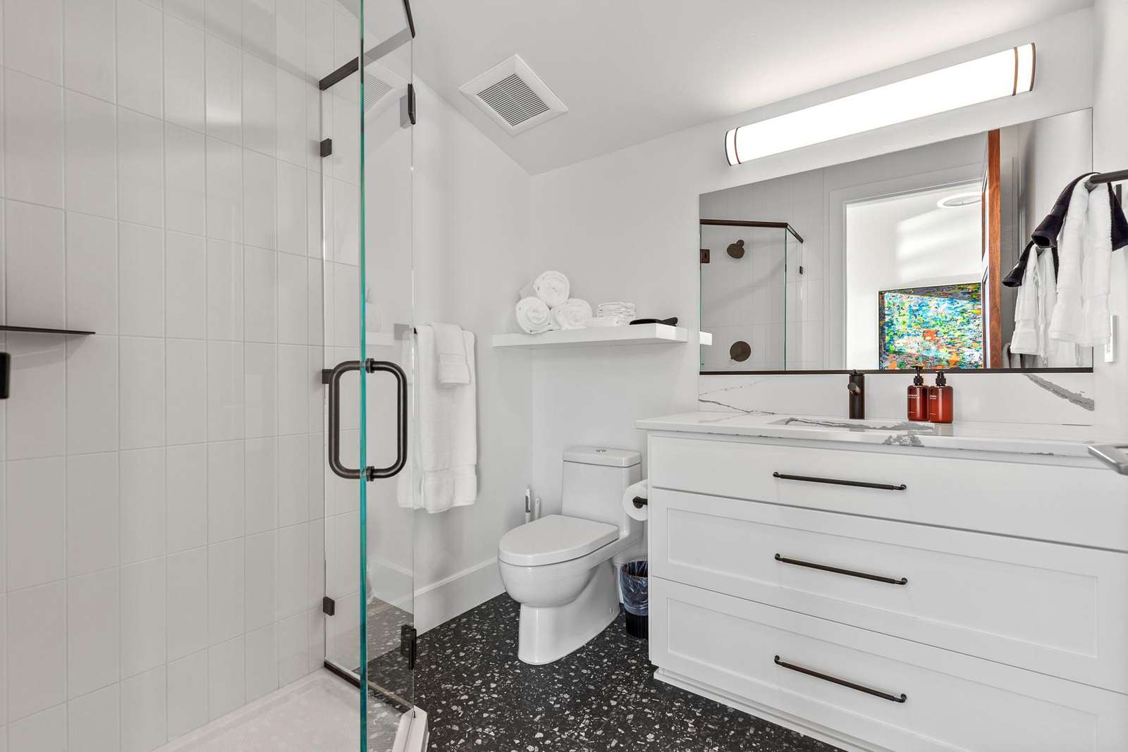Modern bathroom with sleek glass shower and bright vanity