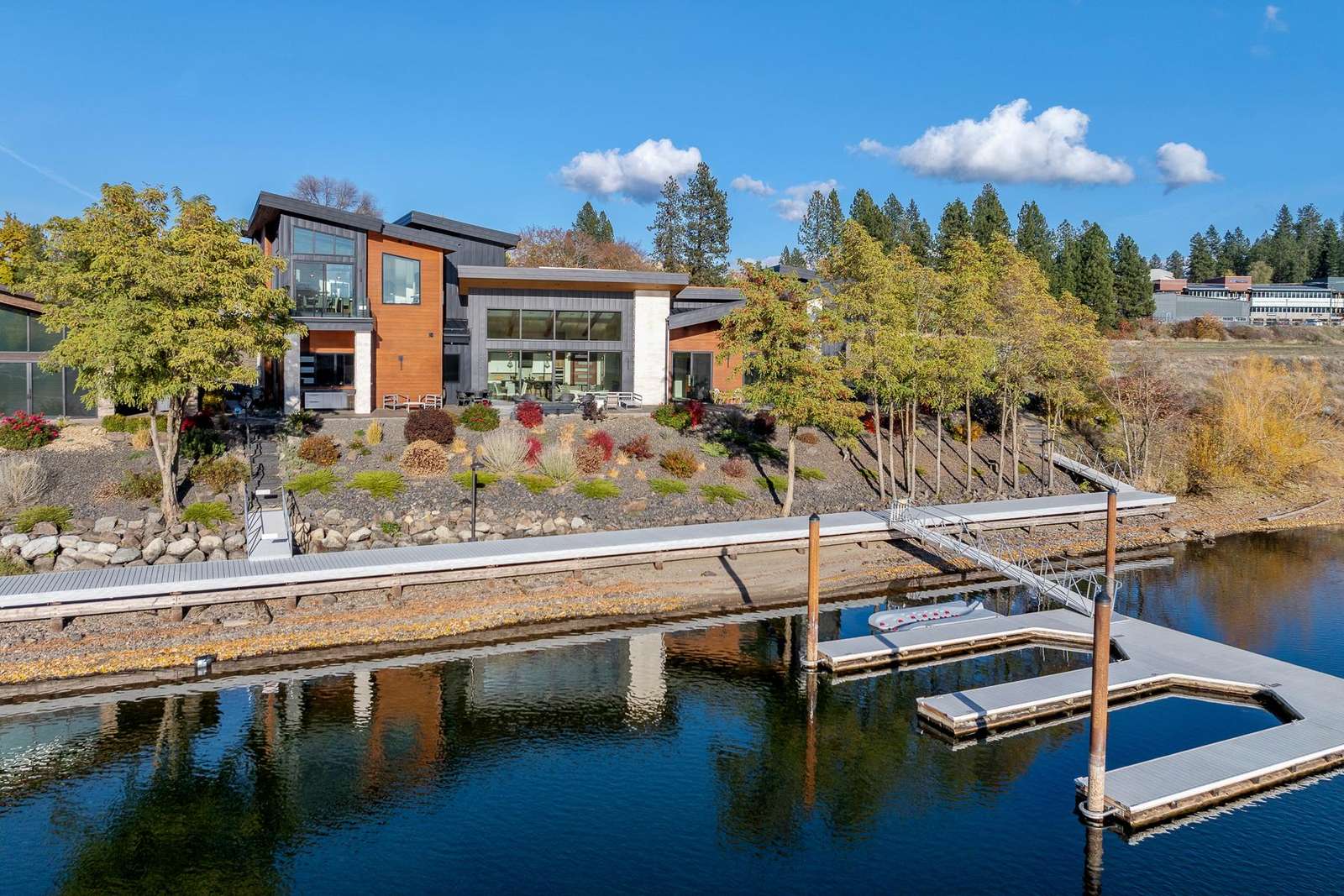 Modern waterfront home with private dock and scenic views