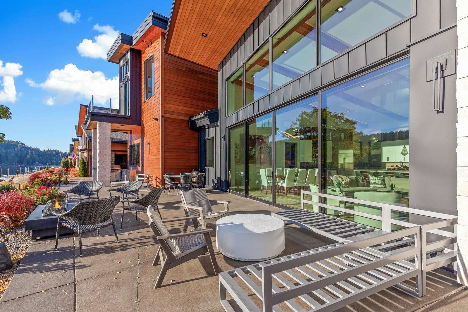 Sun-drenched patio with mountain views and cozy seating