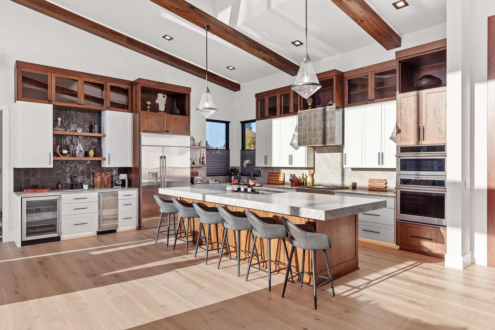 Spacious kitchen with modern amenities and cozy breakfast bar seating