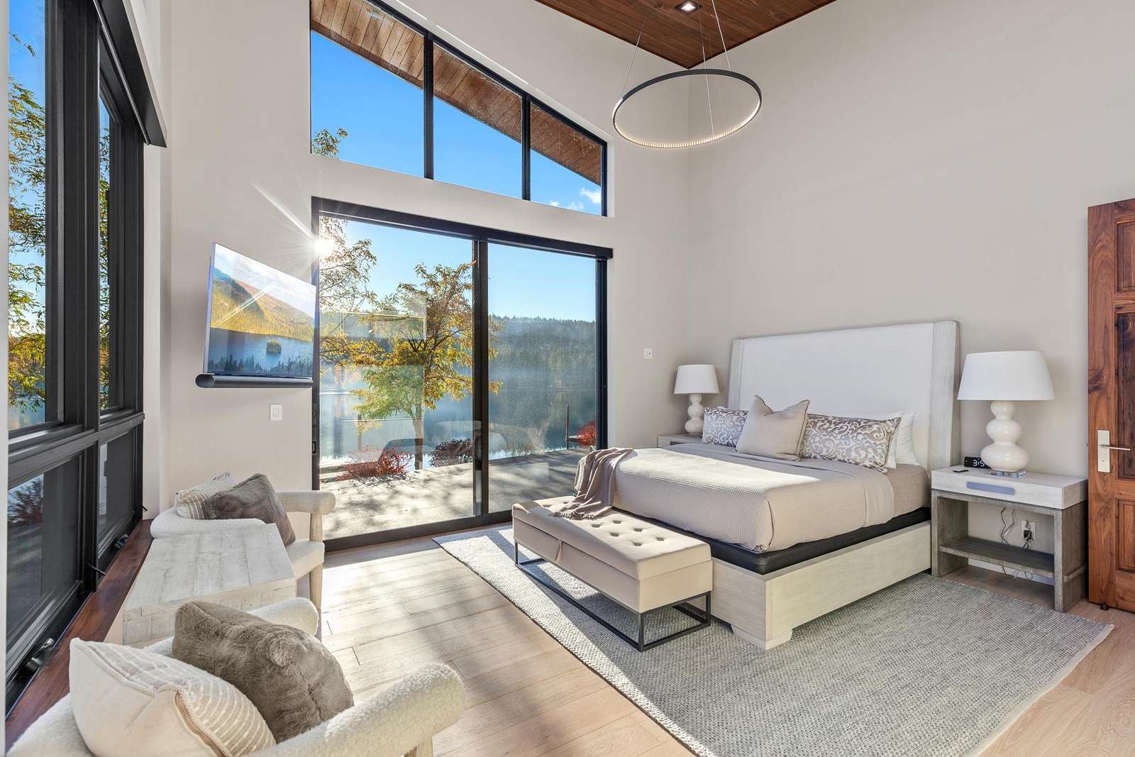 Sunlit bedroom with stunning mountain and lake views