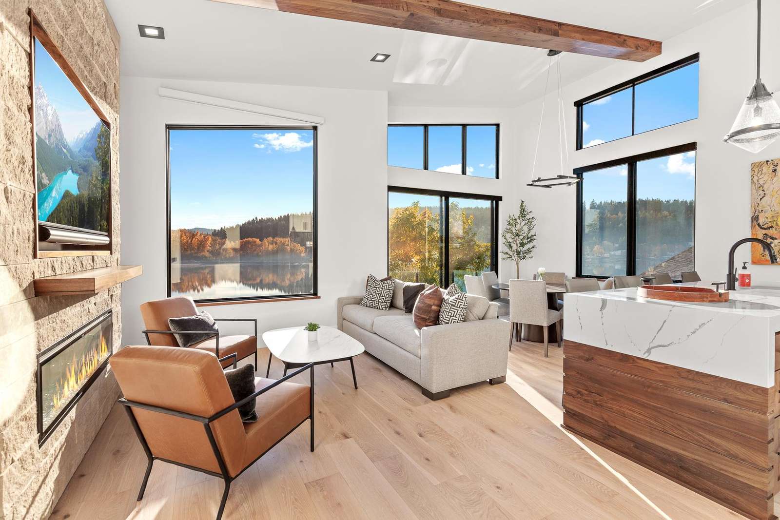 Sunlit living room with panoramic desert views and cozy fireplace