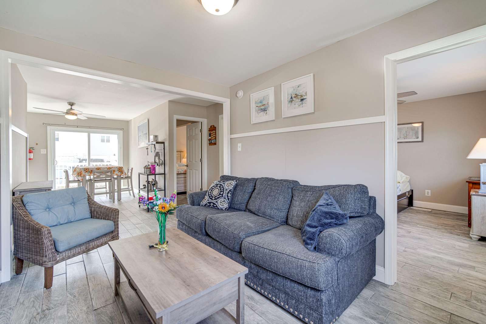 Cozy living room with stylish seating and natural light - property