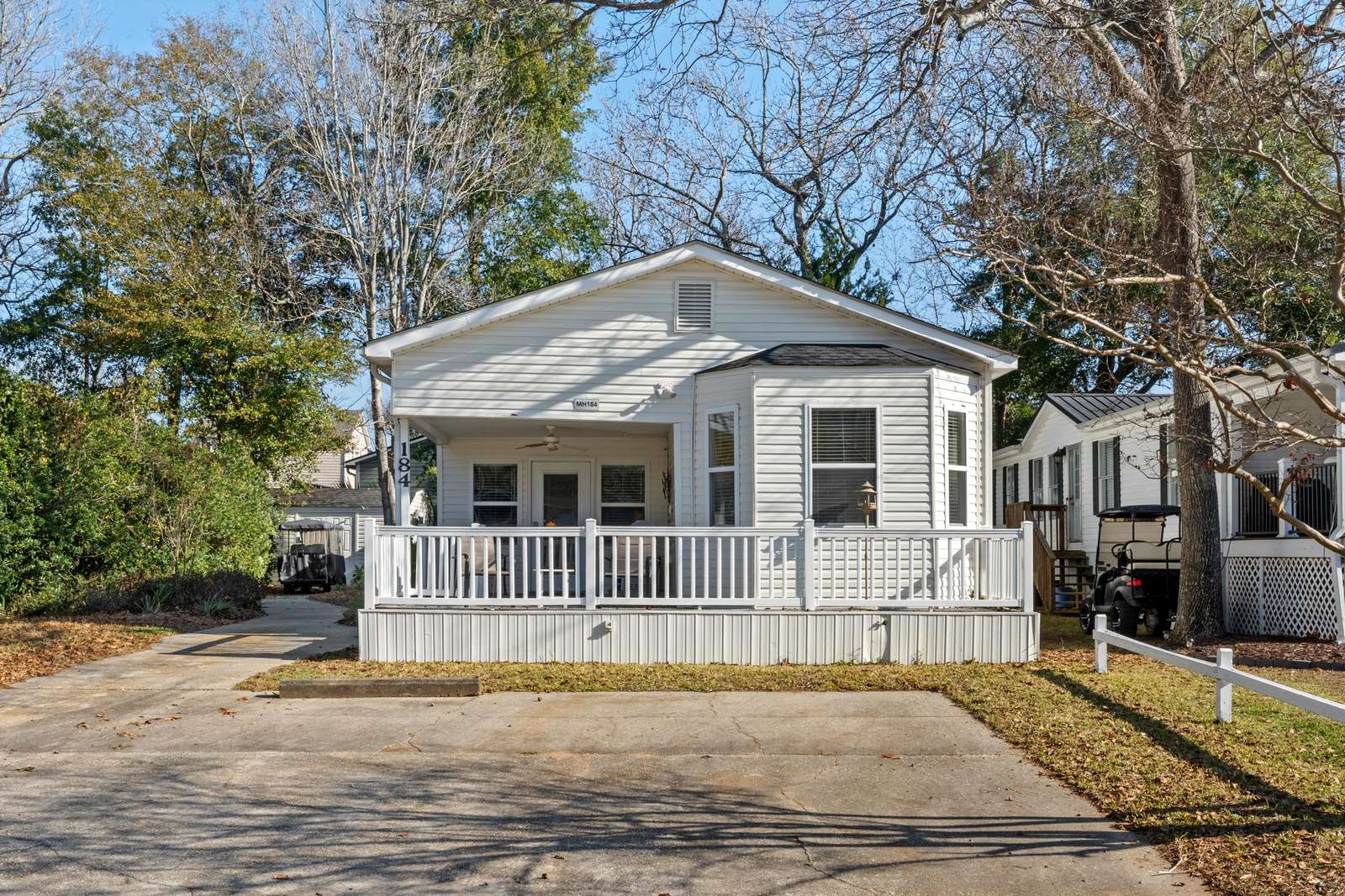 Charming front porch retreat with spacious parking area - property