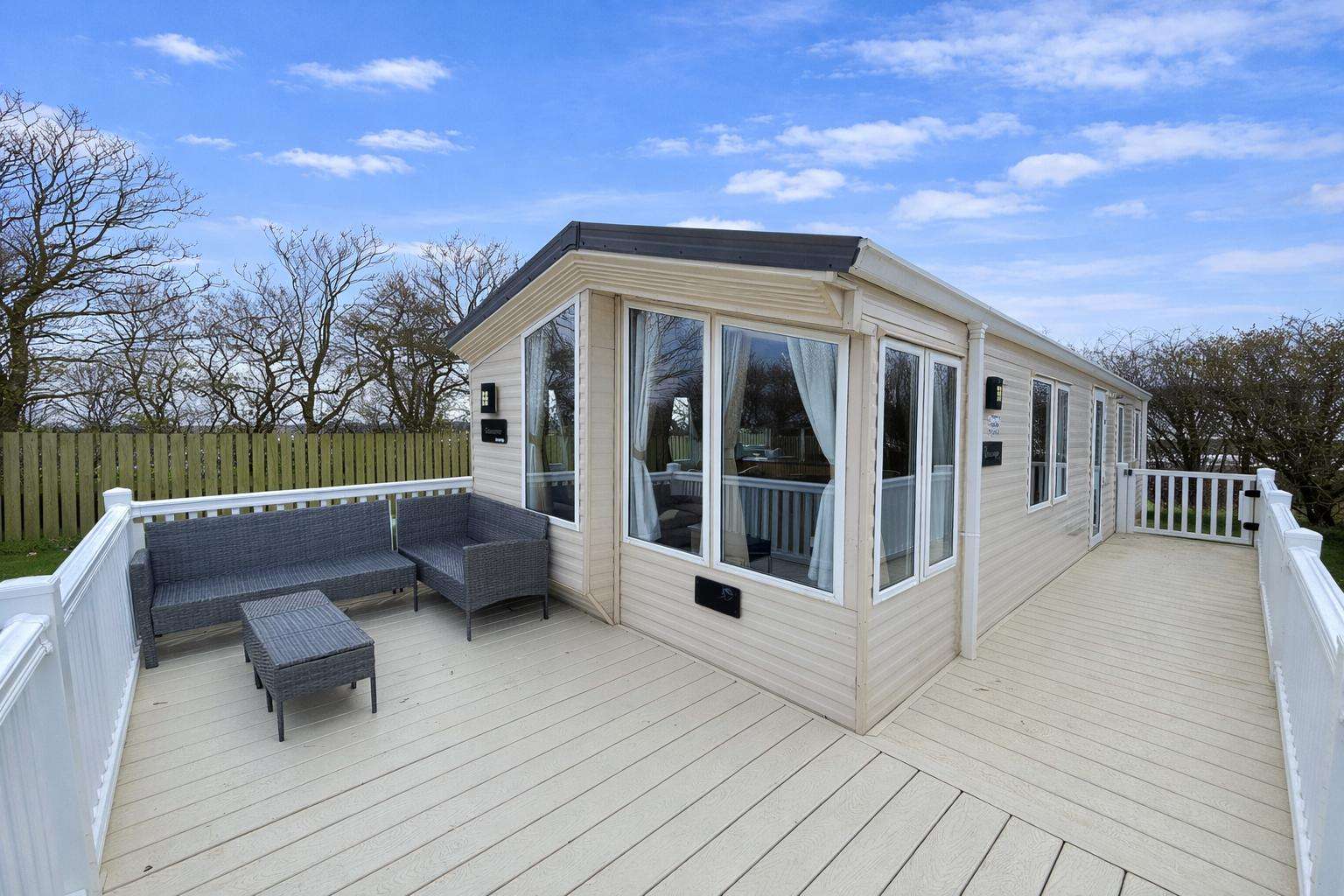Enjoy relaxing on the deck of this 3 bed caravan in Withernsea Yorkshire. The whole family will love they stay here. - property