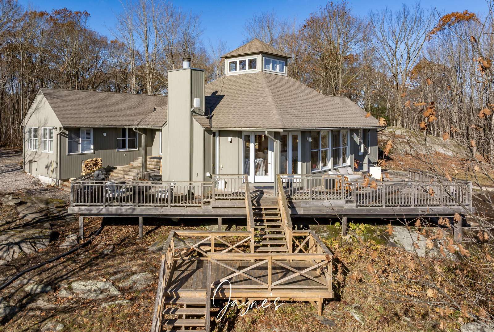 Spacious lakeside deck with stunning water views and cozy seating