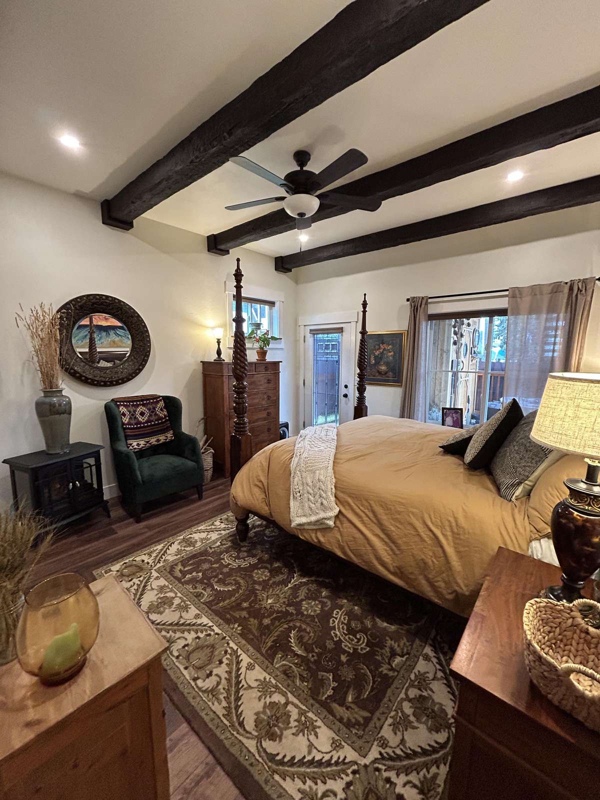 Cozy bedroom retreat with rustic beams and warm lighting