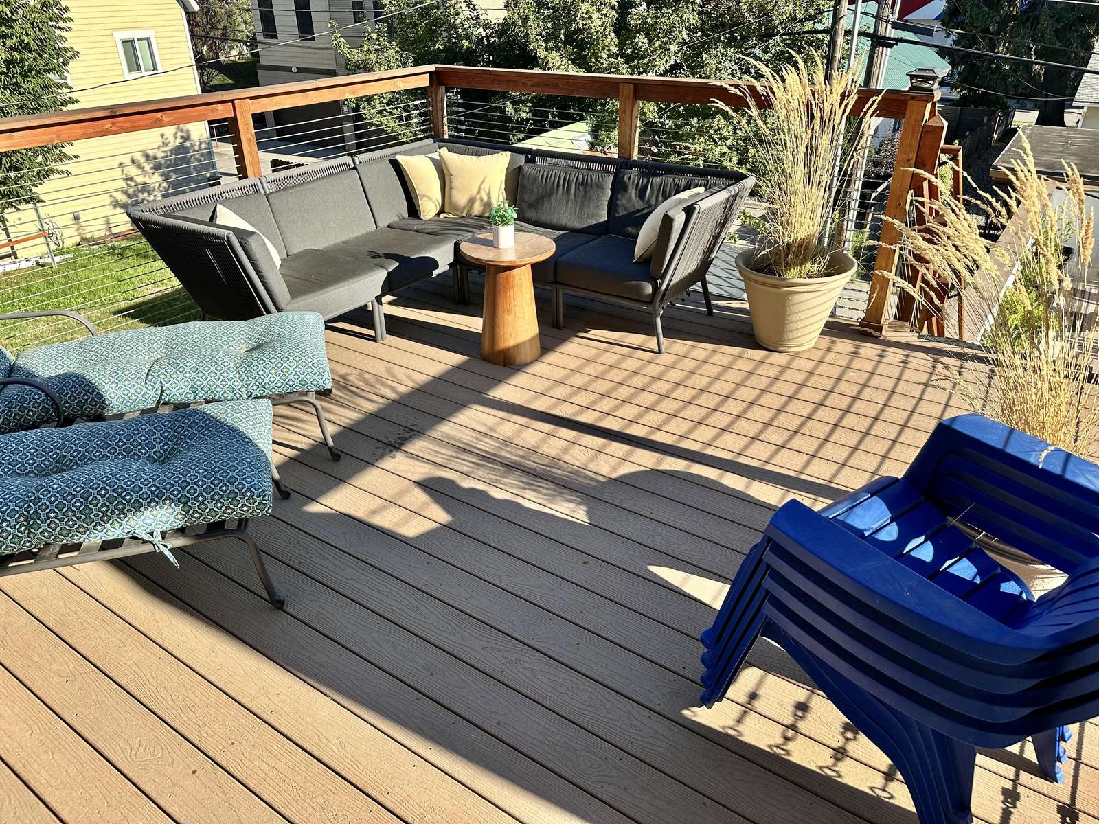 Sunlit deck with cozy seating for relaxing gatherings