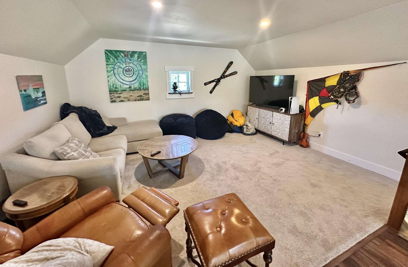 Cozy living room with plush seating and vibrant art