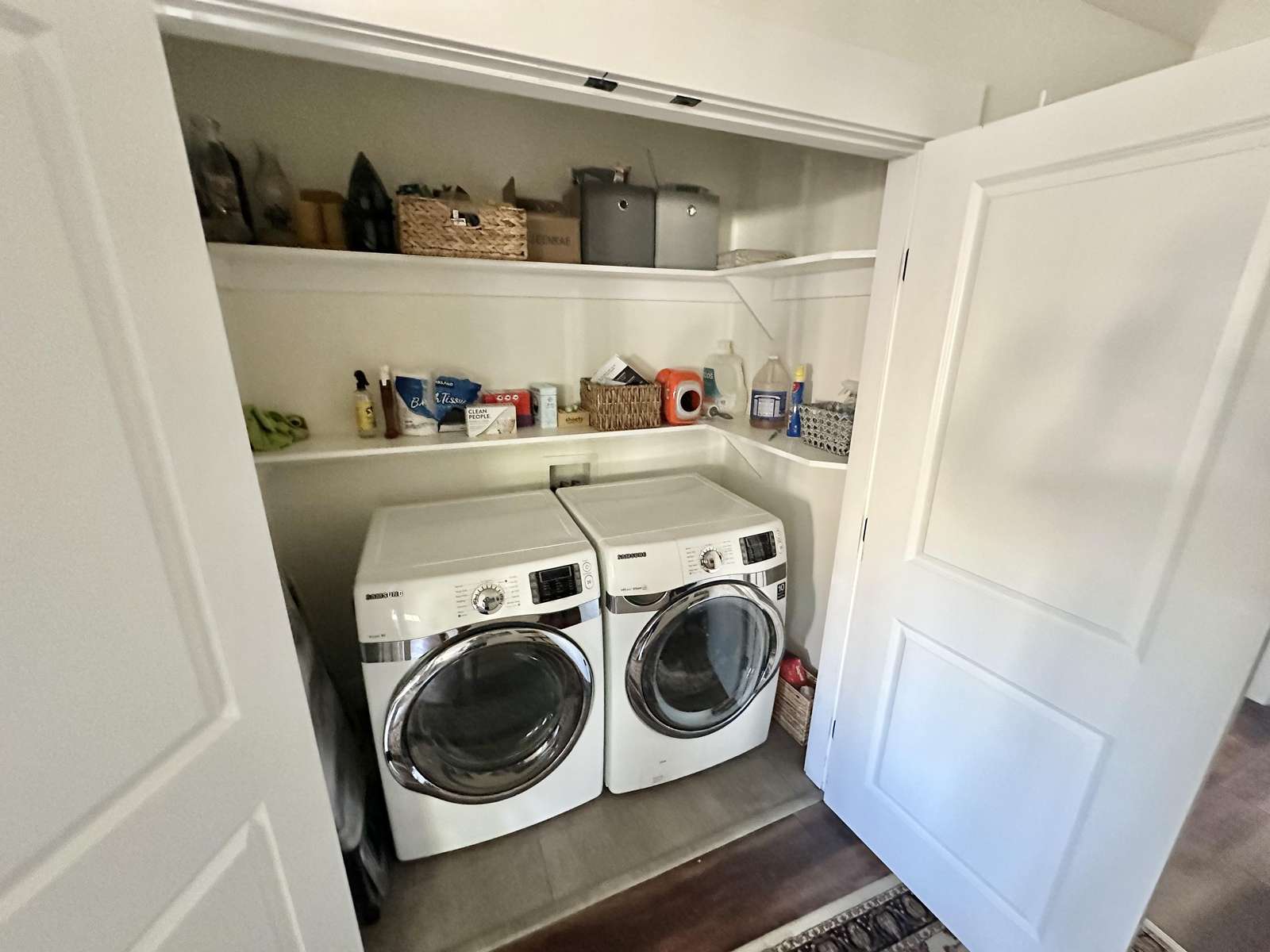 Bright laundry nook with modern washer and dryer amenities