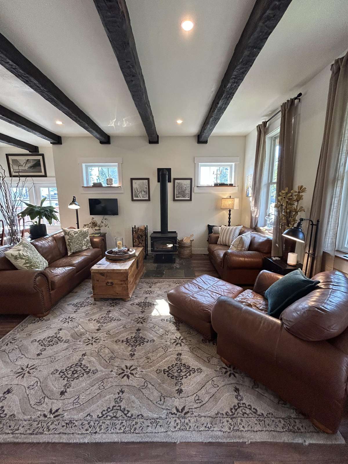 Cozy living room with rustic beams and warm seating