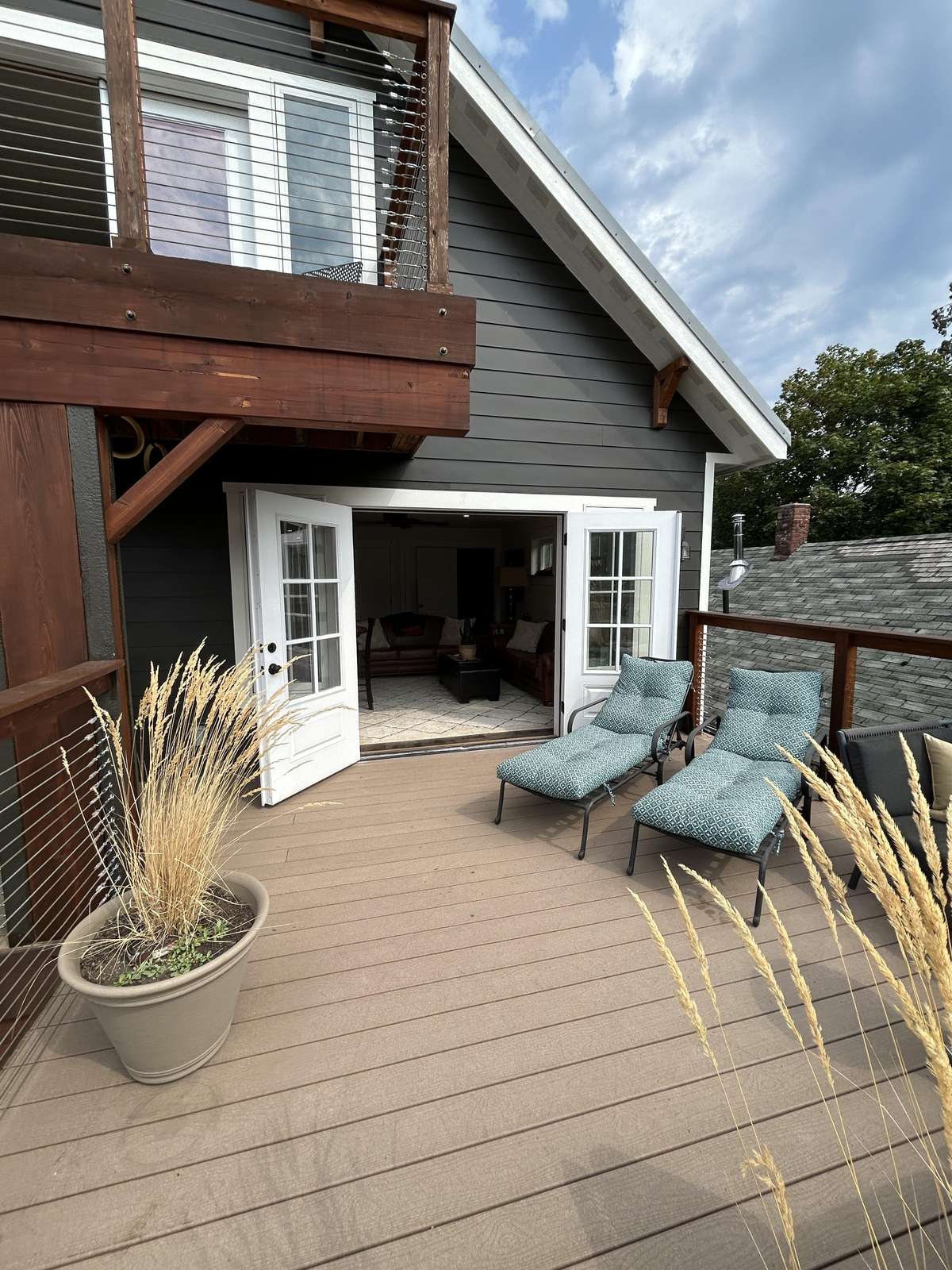 Sunny deck retreat with cozy seating and peaceful views