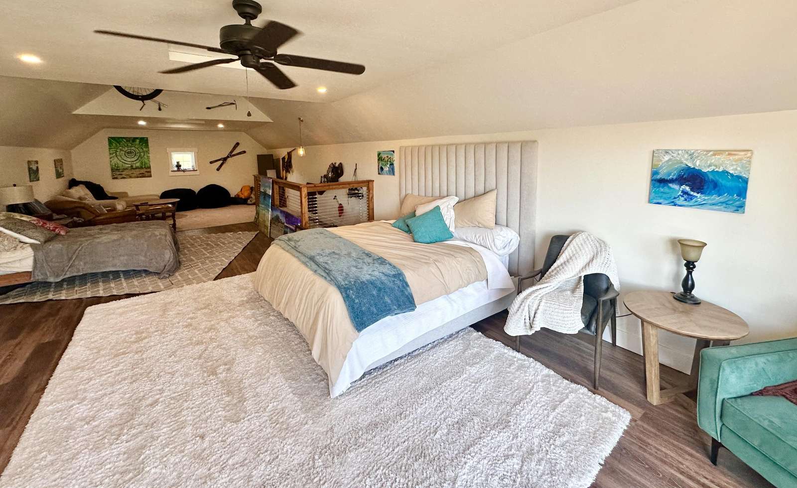 Spacious open-concept bedroom and living area with cozy seating