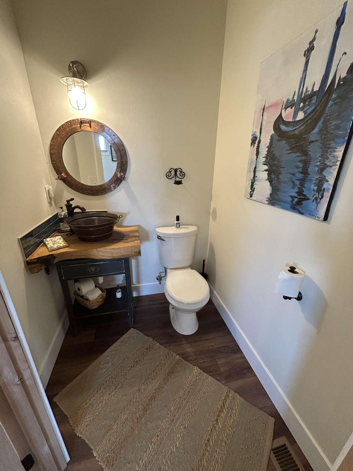 Charming powder room with elegant vessel sink and warm lighting