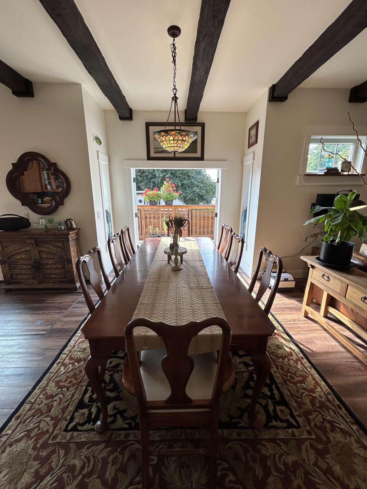 Sunlit dining room with rustic charm and cozy ambiance