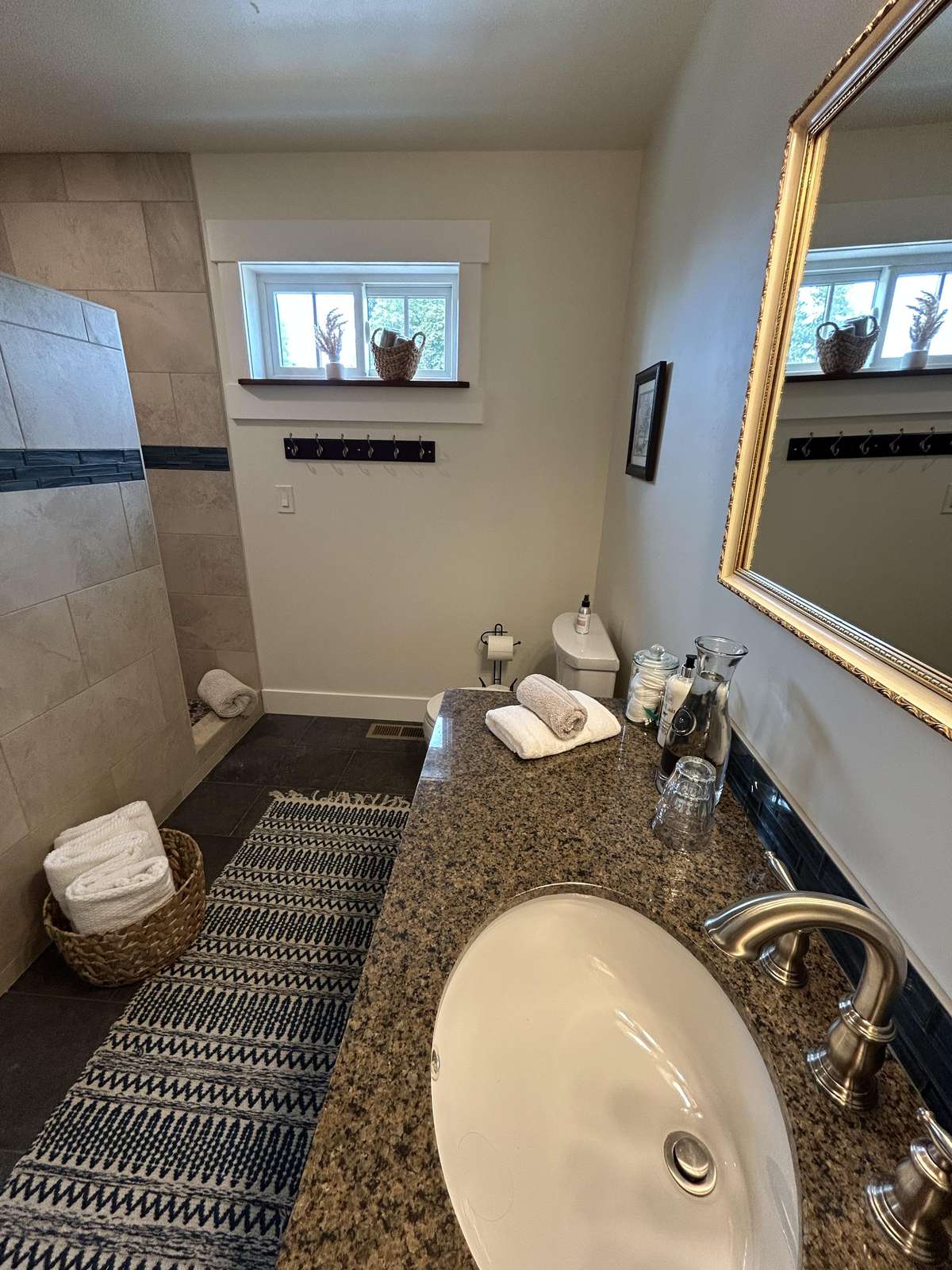 Cozy bathroom retreat with granite countertop and natural light