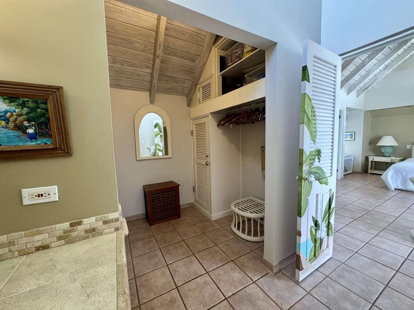 Bright, airy entryway with vaulted ceilings and tropical accents