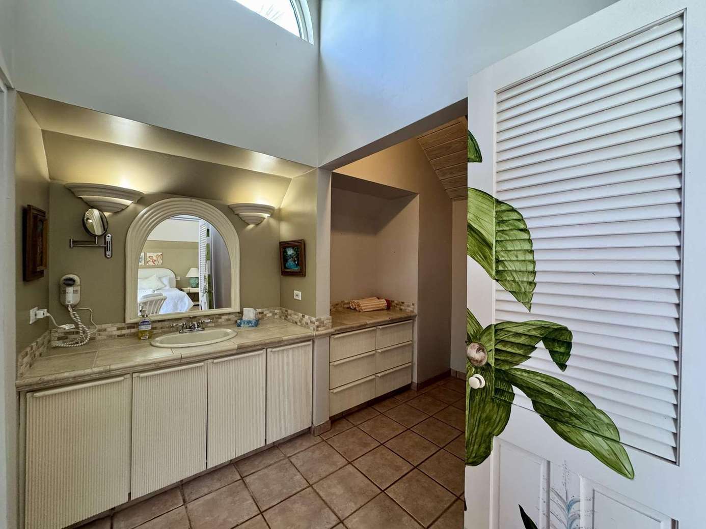 Bright, spacious bathroom with skylight and modern amenities