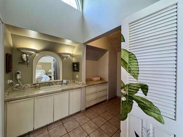 Bright, spacious bathroom with skylight and modern amenities