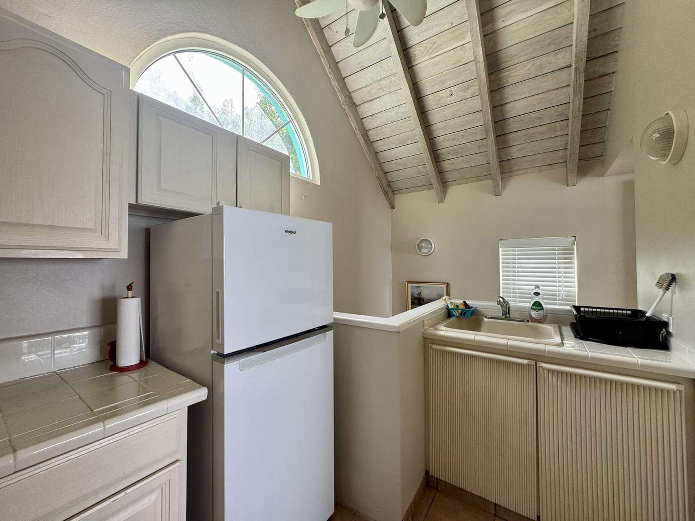 Cozy kitchen with vaulted ceilings and bright natural light