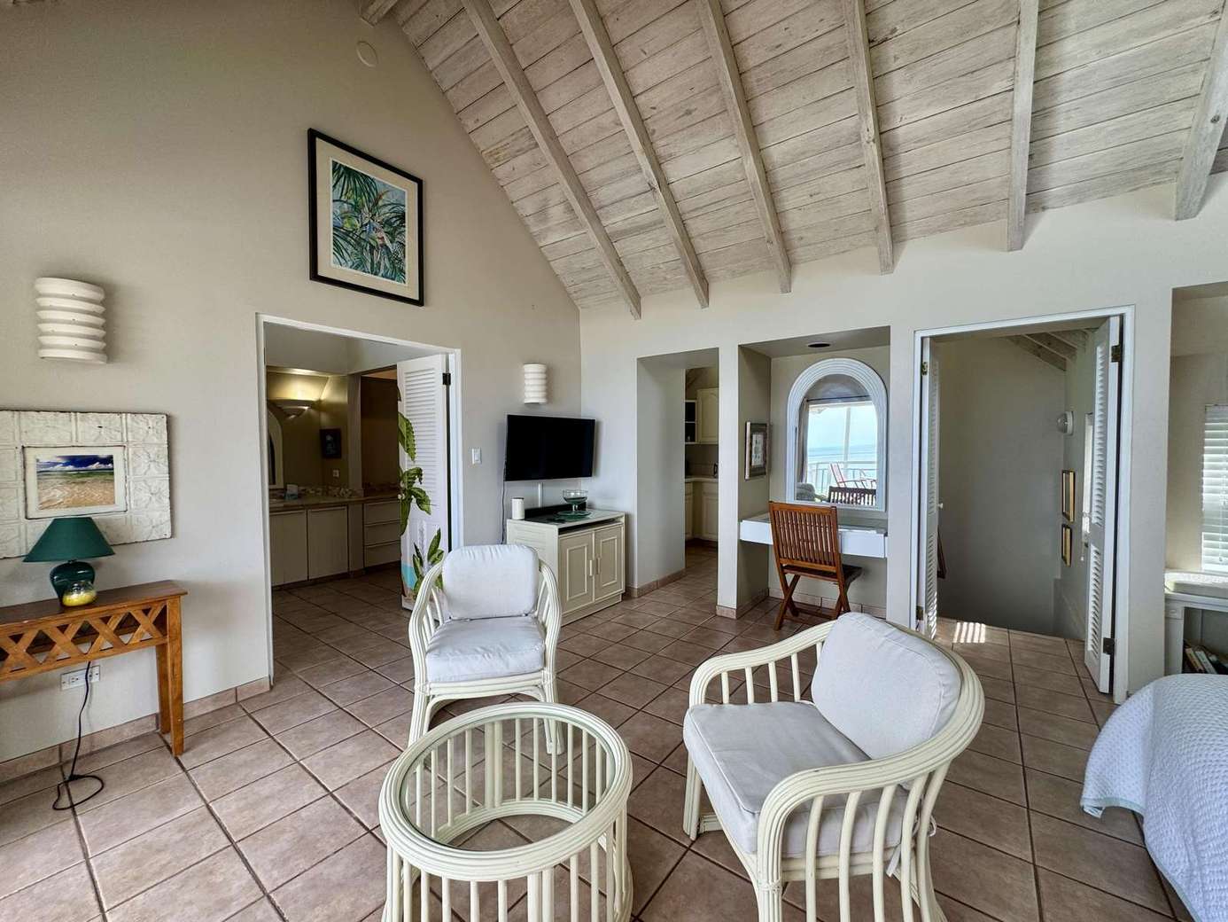 Airy living room with vaulted ceilings and cozy seating