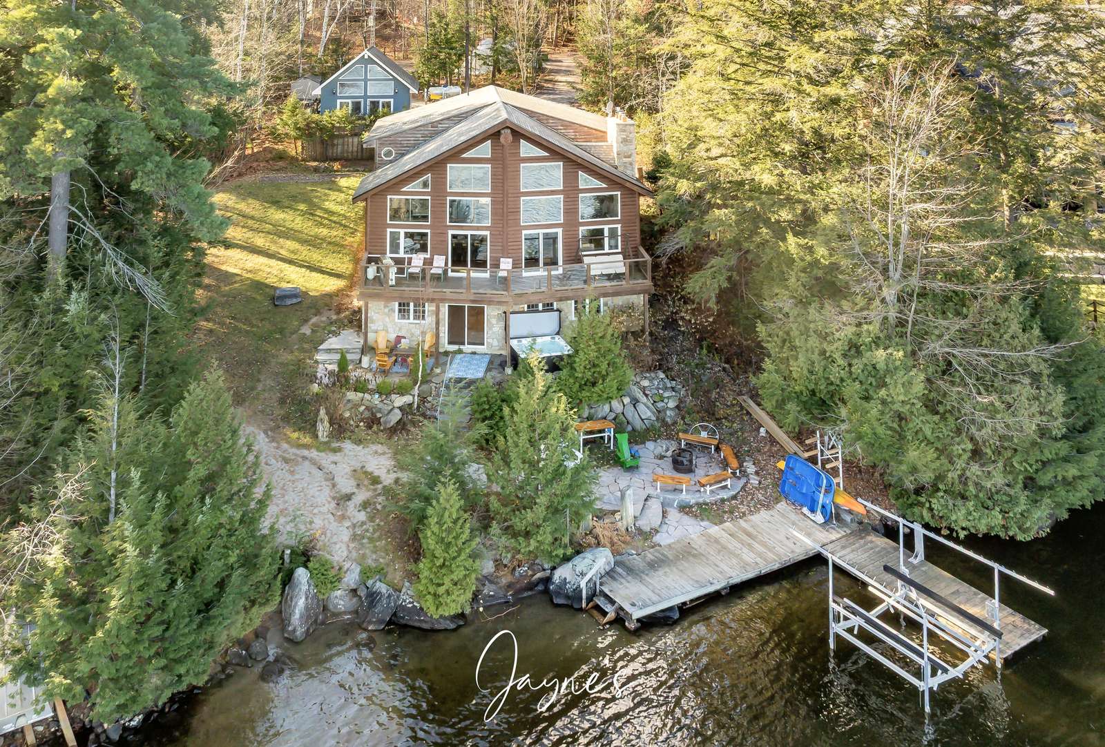 Secluded lakeside cabin with private dock and forest views - property