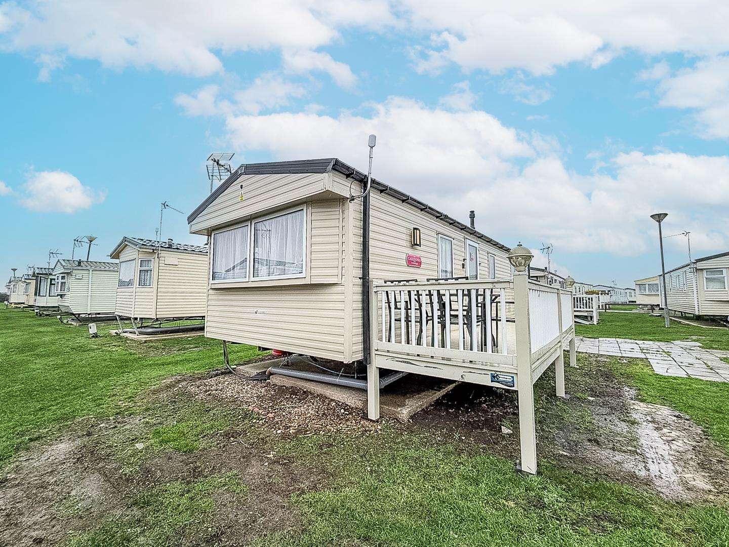 Enjoy a stay at this beautiful caravan in St Osyth Beach, the decking is the perfect place to relax in the sun with friends. - property