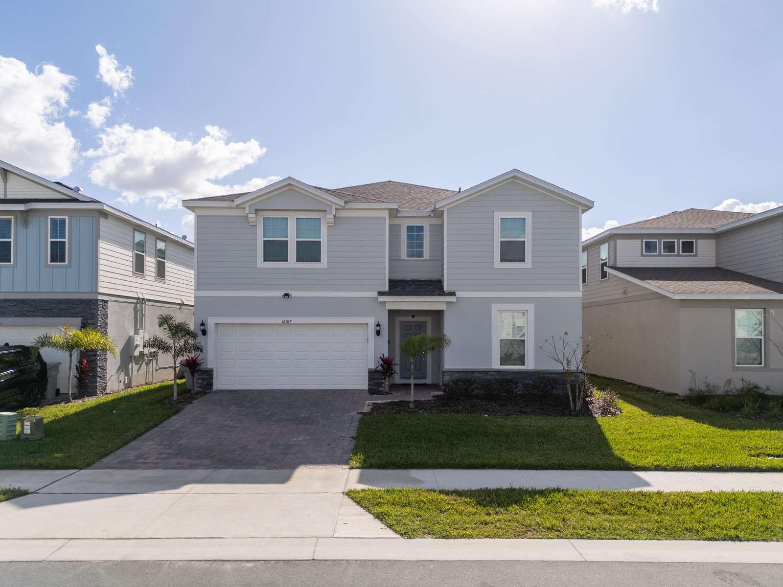 Spacious modern home with bright curb appeal and garage - property